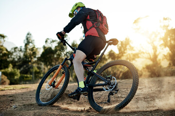 Naklejka premium Mountain bike, travel and man with fitness, energy and challenge with competition. Person, adrenaline and cyclist with practice, hobby or countryside with adventure, journey or nature with sports