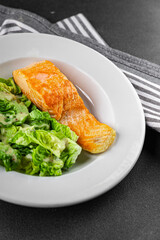 Salmon fried fish seafood dish fresh delicious gourmet food background on the table rustic food top view copy space keto paleo diet vegetarian food pescetarian diet