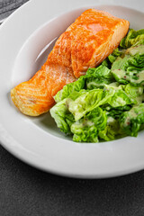 Salmon fried fish seafood dish fresh delicious gourmet food background on the table rustic food top view copy space keto paleo diet vegetarian food pescetarian diet