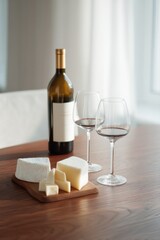 minimalistic arrangement of wine and gourmet cheeses on polished wooden table