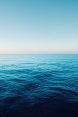 Fototapeta premium drone-shot aerial view of vast ocean expanse on world oceans day emphasizing clean lines and gentle waves rolling undisturbed