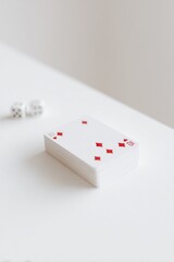 Fototapeta na wymiar pristine minimalistic shot featuring single deck of playing cards on vast clean white table