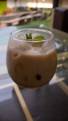 Iced Milk Coffee in a Clear Glass – Refreshing Café Beverage