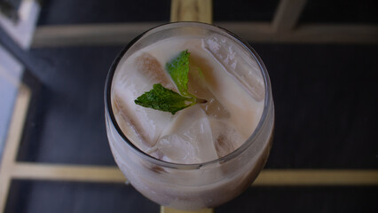 Iced Milk Coffee in a Clear Glass – Refreshing Café Beverage