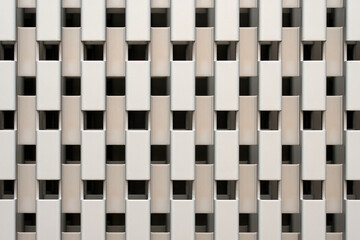 Modern architectural wall with repeating rectangular pattern. Abstract urban texture in beige...
