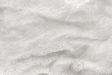 Texture of crumpled medical bandage. Gauze fabric background