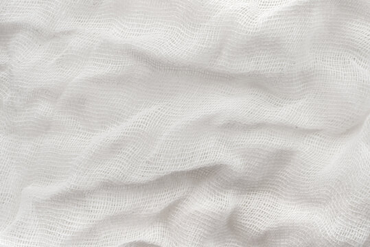 Texture of crumpled medical bandage. Gauze fabric background