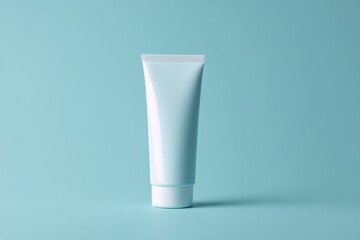 single tube of toothpaste stands upright on seamless smooth solid color background