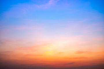 Fototapeta premium Beautiful , luxury soft gradient orange gold clouds and sunlight on the blue sky perfect for the background, take in evening,Twilight, Large size, high definition landscape photo