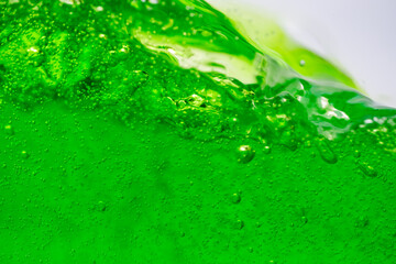Water wave, close up of vibrant green liquid with bubbles, capturing dynamic movement and freshness. Perfect for backgrounds, beverages, or abstract concepts. soft drink
