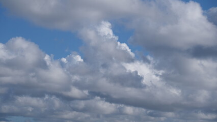 The appearance of clouds in a clear sky with a few overcast clouds