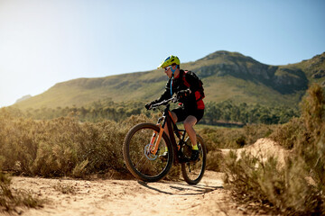Mountain bike, sports and man riding on dirt road for gravel race, challenge or competition...