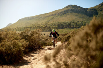 Mountain bike, fitness and man riding on dirt road for gravel race, challenge or competition...