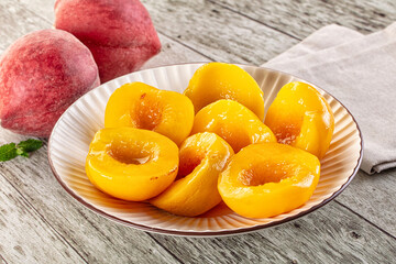 Sweet ripe yellow canned peaches