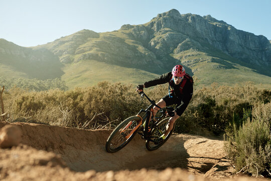 Bike, off road and trail with cyclist on mountain trail for adrenaline, adventure or training. Exercise, fitness and hobby with sports man cycling in nature for challenge, health or performance