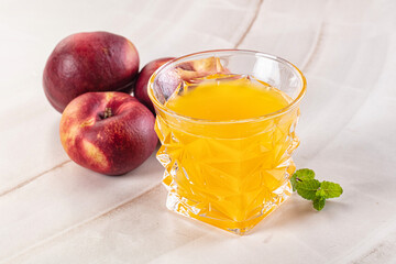 Vitamin beverage - peach juice glass