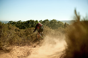Dust, man and bike in nature for fitness, exercise and training for triathlon competition. Athlete, bicycle and outdoor challenge on mountain trail for sport, travel adventure or workout in Australia