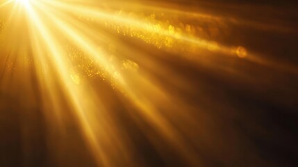A radiant golden light beam shining through a dark background, casting a warm glow.