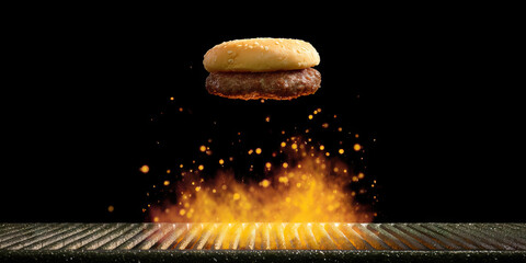 Hamburger Bun and Patty Above Flaming Grill