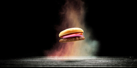 Hamburger with Tomato and Onion over Grill