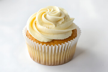 Delicious vanilla cupcake with creamy frosting on a white background. Sweet, simple, and elegant — perfect for dessert lovers and minimal style