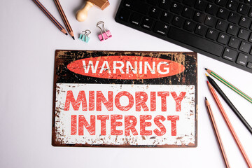 Minority Interest Concept. Warning Sign and Office Supplies