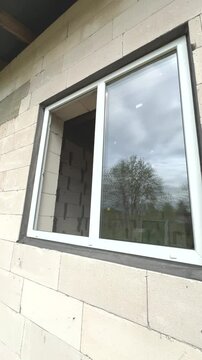 Plastic windows in the process of installation. Replacing windows in the house. New windows.