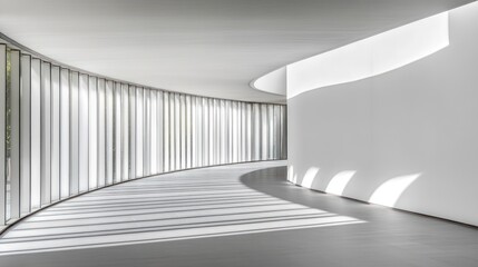 Obraz premium Modern curved hallway with white walls, glass panels, and sunlit floor.