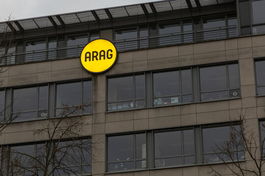 The ARAG logo, a yellow circle with black lettering, on the side of a modern office building. Business and corporate identity concept. Berlin, Germany. 29 March 2025.
