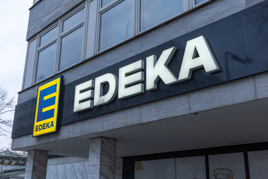 Modern EDEKA supermarket logo sign on the exterior of a commercial building in Germany, showcasing the logo and architectural facade. Berlin, Germany. 29 March 2025.