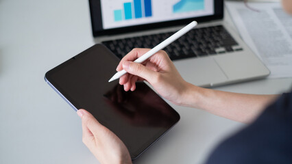Business person working on tablet chart graph data analysis office computer hand digital technology concept