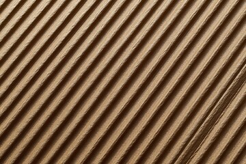 Close up of brown corrugated cardboard surface with diagonal ridges and texture