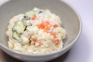 Close-up of Japanese potato salad with cucumber and carrot