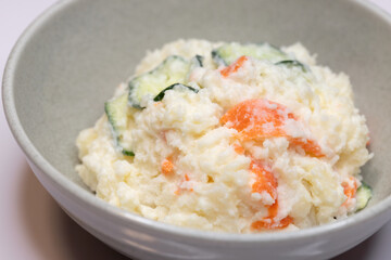 Close-up of Japanese potato salad with cucumber and carrot