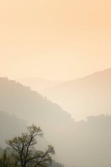 Fototapeta premium Misty Mountain Landscape: A Serene Sunrise Painting