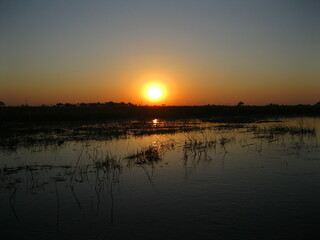 Obraz premium Natural South african river illuminated by Beautiful clear skies sunrise