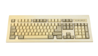 Vintage computer keyboard from the 1990s isolated on white background.