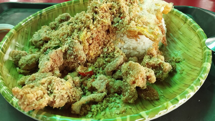 cereal covered fried chicken chops with rice and fried egg