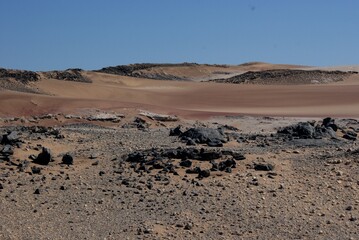 Expansive dry Desert Landscape with Rolling Sand Dunes in Namibia