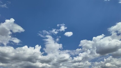 Timelapse of soft white clouds moving clear blue sky - Powered by Adobe