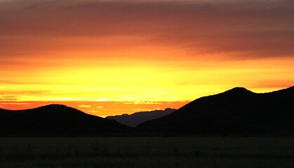 Stunning Sunset Sky With Vibrant Clouds Over Serene Namibian desert Landscape