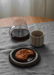 Coffee break - black coffee and peanut butter cookies on the table
