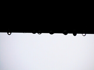 Water drops of rain on the black steel