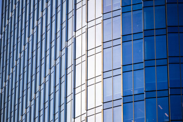 Modern glass architecture and window reflections in Warsaw