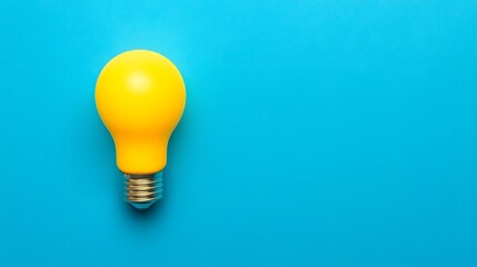 Glowing yellow lightbulb on vibrant blue background