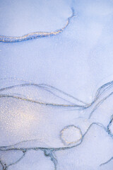 Marble surface in blue tones with glitter effect. Modern abstract stone background.
