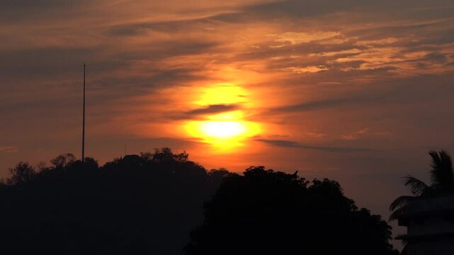 Timelapse shot of a beautiful Sunset over Gandhi Mandap Guwahati- actual duration 7 minutes present duration 55 seconds