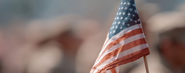 Small American flag waves gently during military parade