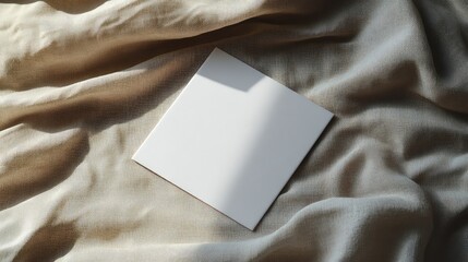 Landscape brochure mockup with glossy finish placed on textured fabric, ideal for luxury branding