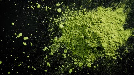 Matcha and acai powder particles scattered in artistic explosion, top-down on black